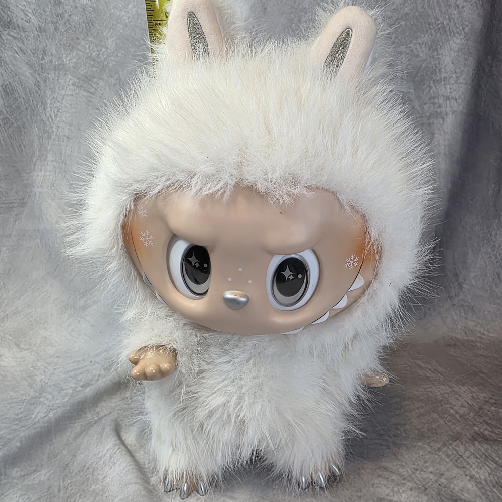 POP MART The Monsters Angel in Clouds doll, featuring a white plush body, irides